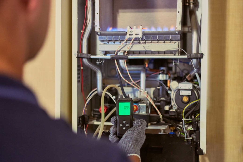 Home inspector examining an electrical panel during a Boulder County inspection
